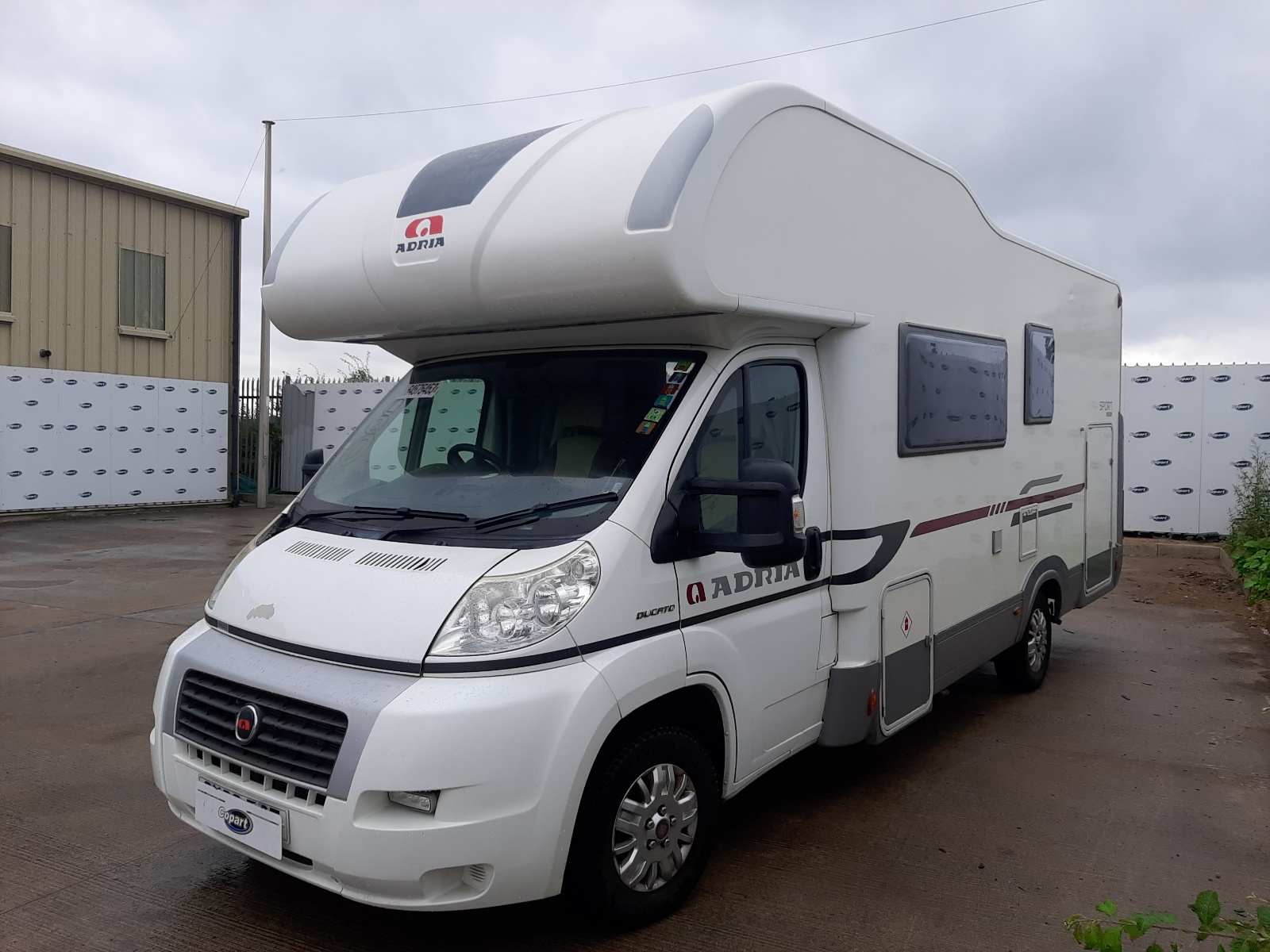 A White Fiat Ducato from the front-right.