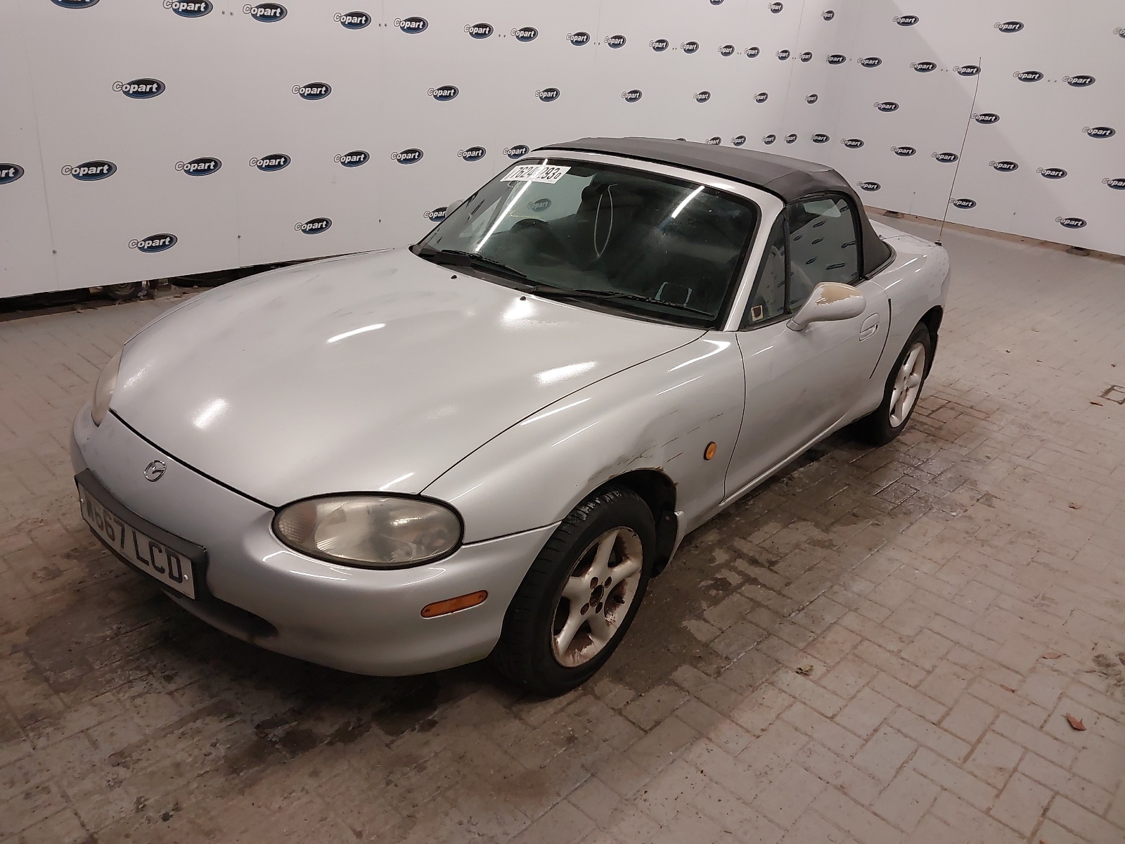 A Silver Mazda MX-5 from the front-right